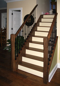 The hardwood stair treads here are out of maple with a dark walnut 